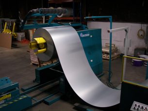 Steel coil being removed from the press