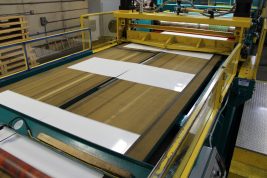 aluminum sign blanks on the press at Wrisco